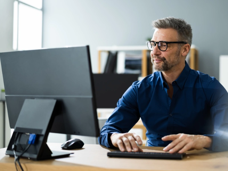 Image of a marketing professional on the computer.