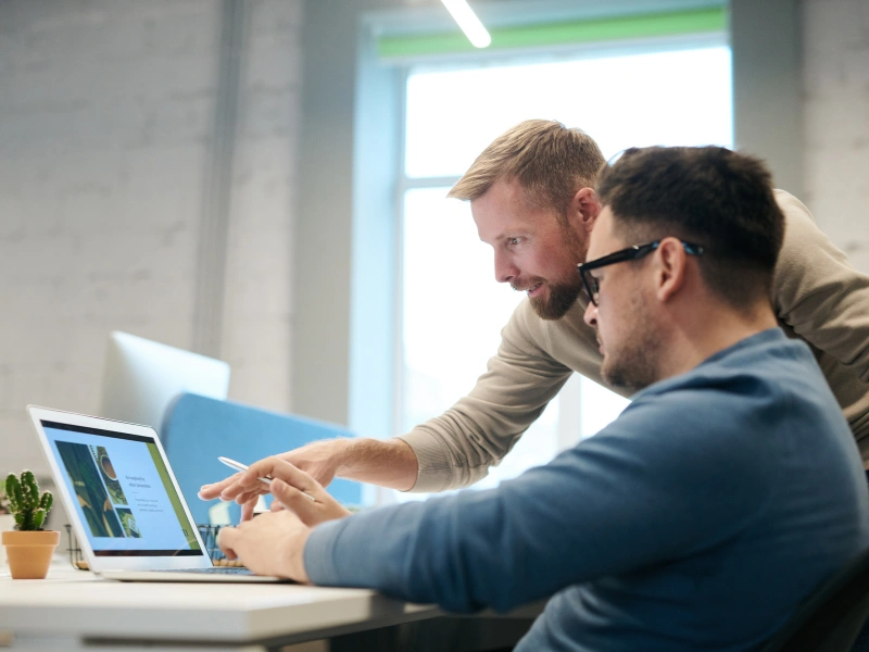 Image of two marketing professionals talking together.